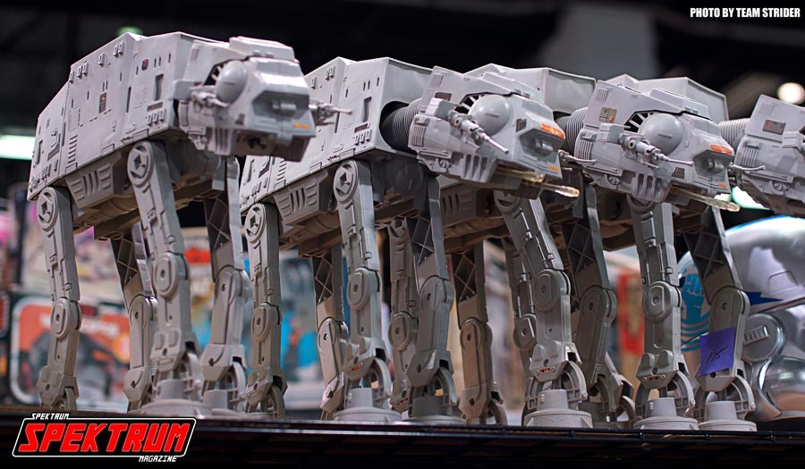 Row of AT-AT's on a shelf. Love these classic toys