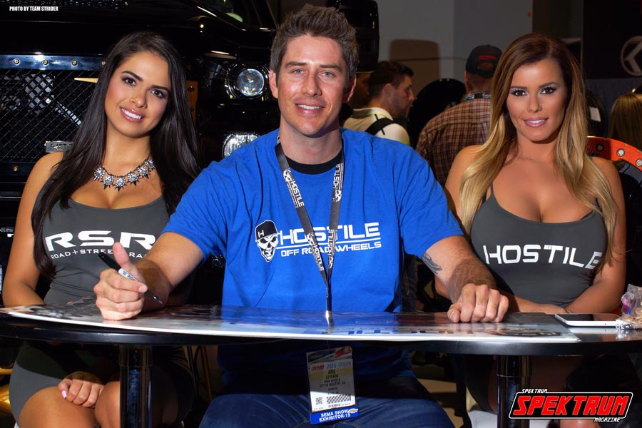 Race car driver Arie Luyendyk Jr. with models Franchesca & Candice at the MKW Wheels booth