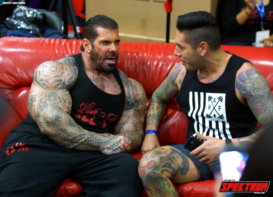 Bodybuilder Rich Piana sits with a fan at the FitExpo 2016