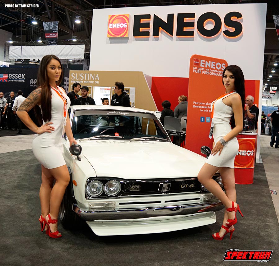 Lovely models from Eneos in front of a classic Nissan GTR